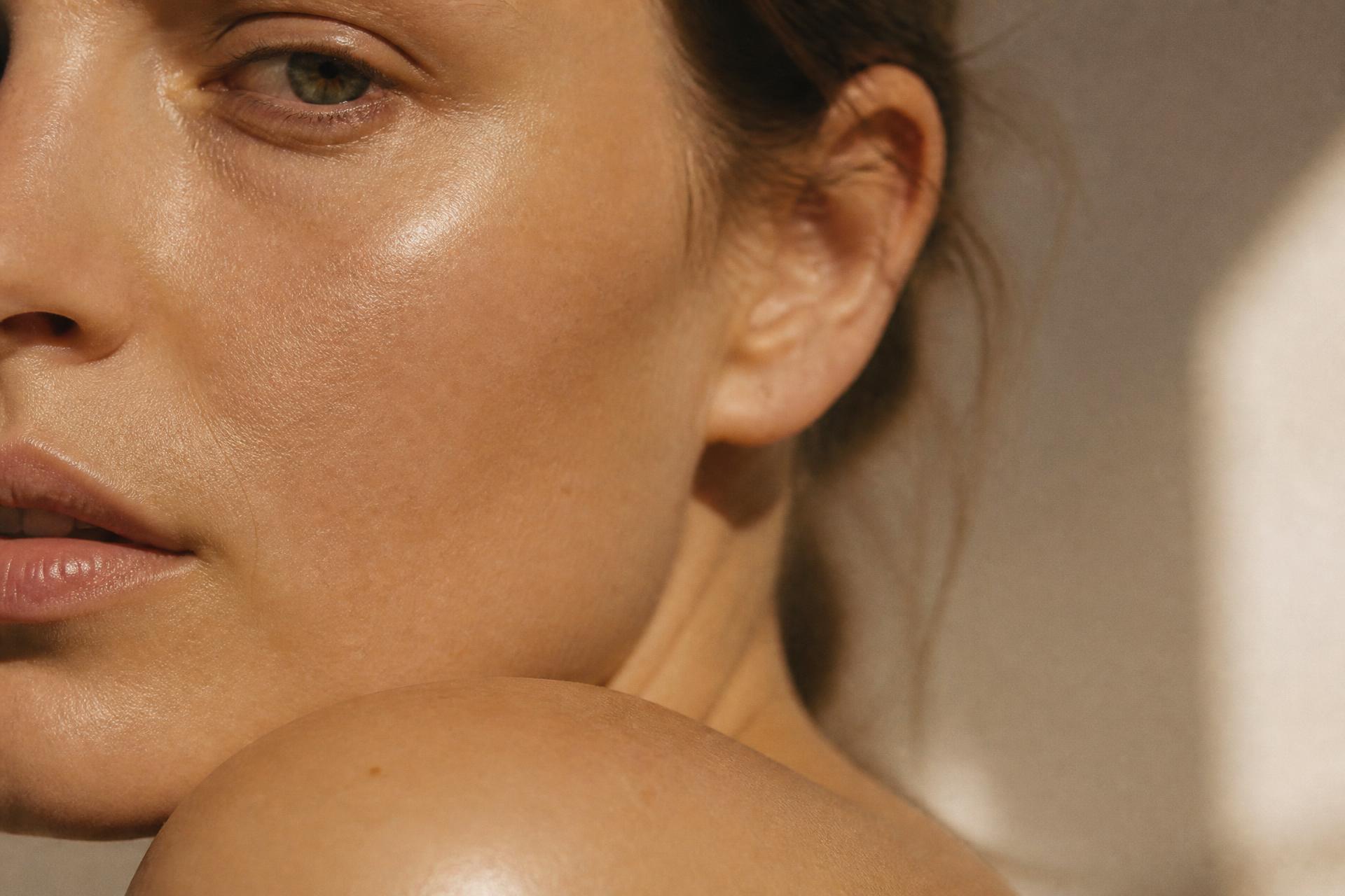 Close-up of naturally radiant, healthy-looking skin in warm daylight